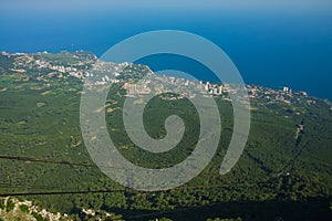 View from Ay petri mountain towards the crimean sea, with visible cable car lines leading to the lower station