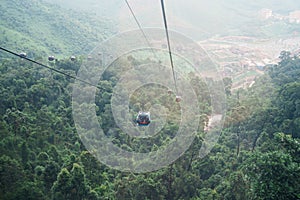 View of Ba Na Hills Mountain in the fog from Cable car. Landmark and popular. Da Nang, Vietnam and Southeast Asia travel concept