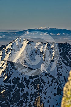 View of Babia hora hill from Rysy in High Tatras mountains during winter evening photo