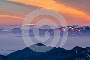 View of Babia Hora mountain from Chopok during winter sunrise