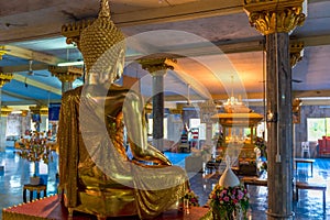 View from the back of a Buddha sculpture in an empty temple