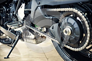 View of the back of a motorcycle with an emphasis on the chain