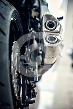 View of the back of a motorcycle with an emphasis on the chain