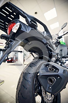 View of the back of a motorcycle with an emphasis on the chain