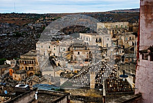 The view on the back side of the Italy citoy of Matera by river canyon with undergrounds palaeolithic cave