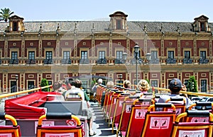 View from back of top deck on open roofed tour bus