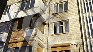 View of the balcony and a broken window after the fire in block of flats