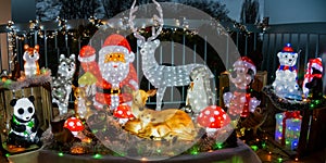 view of a balcony with characters illuminated at Christmas