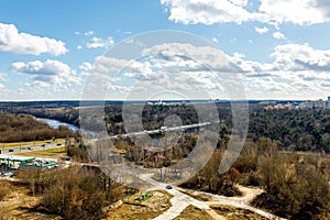 View from the balcony to the river and the industrial area with blue skies and clouds