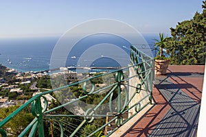 View from a balcony to the sea of Capri Island on a sunny day in Naples, Italy at summertime