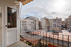 View from a balcony of typical inner courtyard in the Eixample district, Barcelona, Catalonia, Spain on cloudy day.