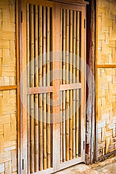 View of the bamboo door in Louangphabang, Laos. Close-up. Vertical.