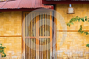 View of the bamboo door in Louangphabang, Laos. Copy space for text.