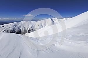 View from Baranec, Western Tatras, Slovakia. Beautiful winter landscape of mountains is covered by snow in wintertime. photo