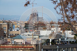 Barcelona roofs against background of Sagrada Familia