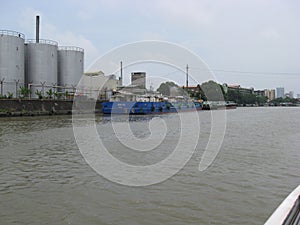 View of barges docked in an industrial area along the Pasig river, Manila, Philippines