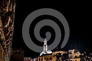 View from the Bari castle of the bell tower of its cathedral during the night