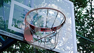 View of a basket on an empty basketball court early in the morning