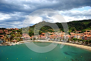 A view of the bay and beach of Collioure with Saint Elme Fort on the hill