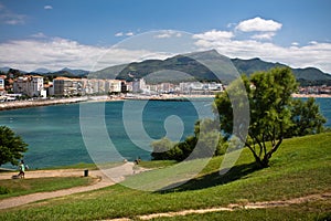 View on bay of colorful saint jean de luz with mountain la rhune in blue sky