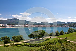 view on bay of colorful saint jean de luz with mountain la rhune in blue sky