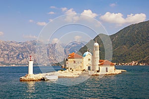 View of Bay of Kotor and Island of Our Lady of the Rocks on sunny summer day. Montenegro
