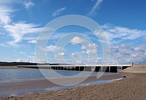 View of the beach at arnside with the leven railway viaduct and river in the south lakes area of cumbria