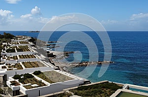 View of the beach, blue sea and modern villas luxury hotel in Gr