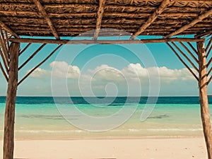 View from a beach cabana on the Caribbean, blue ocean and cloudy sky. A perfect summers day. Tropical background photo