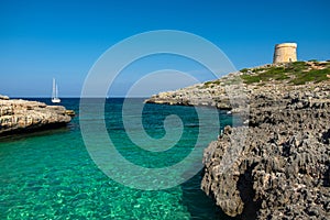 View on the beach Calo Roig and the Defense Tower Alcaufar on Menorca photo
