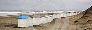 View on the beach huts on the west coast area of Texel. Panoramic view on the North Sea