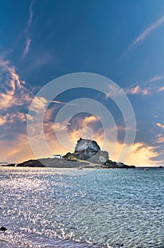 View from beach on Kos island to small rock with church