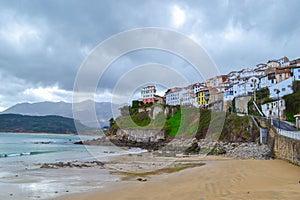 View from the beach of Lastres, Asturias, Spain, of the town, in photo
