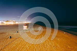 View of the beach at night, in Huntington Beach