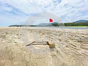 View of a beach with a red danger flag photo