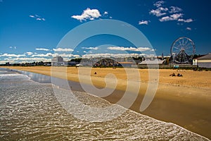 View of the beach and rides from the pier at Old Orchard Beach,