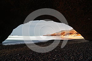 view of the beach and rock arch at Legzira on the Atlantic Coast of Morocco