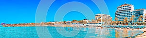 View of the beach and the sea shore of a small resort town Sitge