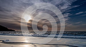 View of Beach at Sunset with Clouds Rolling In