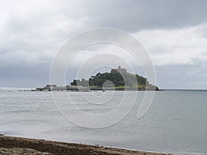 View from the beach to the harbour of Saint Michael\'s Mount Cornwall England photo