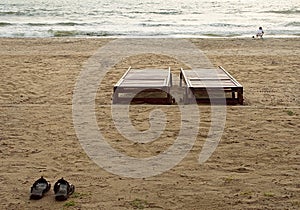 View on seacoast beach with two chears two shoose