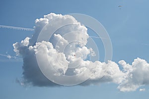 beatiful cumulo nimbus cloud .with paragliders on blue sky background photo