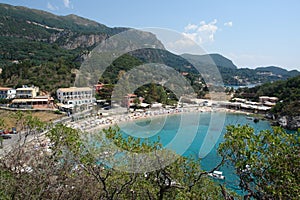 View of a beautiful Agios Spyridon bay and beach in Palaiokastritsa with crystal turquoise sea water, Corfu