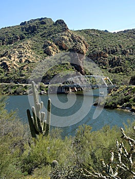 A view of beautiful Apache Lake in Arizona with a small bridge in the frame. pier.