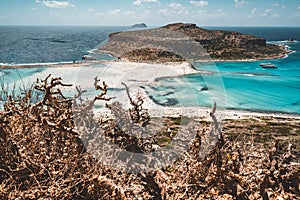View of the beautiful beach in Balos Lagoon, and Gramvousa island on Crete, Greece. Sunny day, blue Sky with clouds.