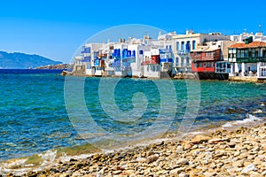 View of beautiful beach and colourful houses of Little Venice part of Mykonos town, Greece