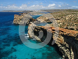 A view of the beautiful blue and turquoise sea at Blue Lagoon Comino, with Gozo in background