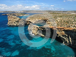 A view of the beautiful blue and turquoise sea at Blue Lagoon Comino, with Gozo in background