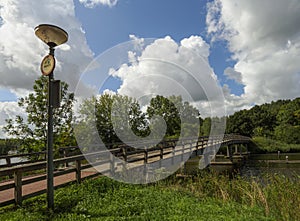 View of the beautiful bridge, houses and canal on an overcast summer day in the Dutch city of Vlaardingen