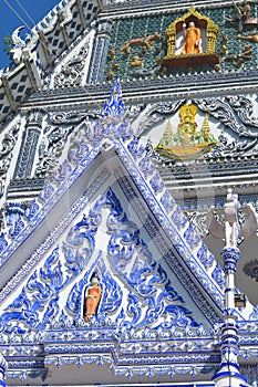 View of the beautiful ceramic gable inside compound of Blue church, Thailand.